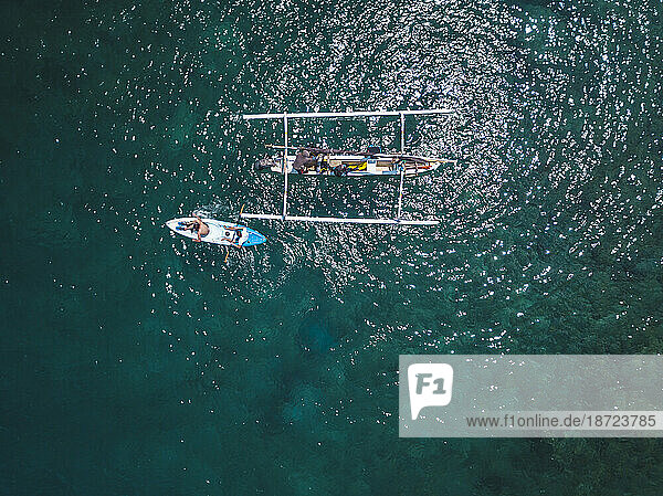 Outrigger and kayak in sea  Amed  Bali  Indonesia
