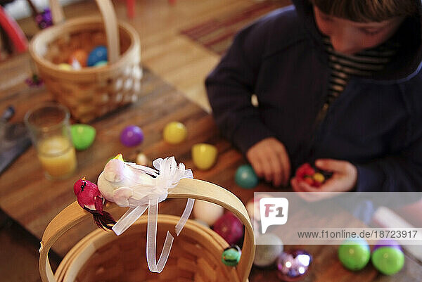 young boy sorts through Easter loot