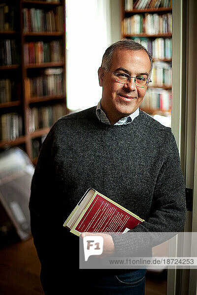 A portrait of an author in his home in Potomac  Maryland.