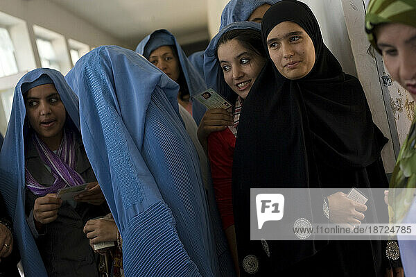 Young Afghan women vote at a local school for presidential and provincial candidates  in Mazar-i Sharif  Afghanistan.