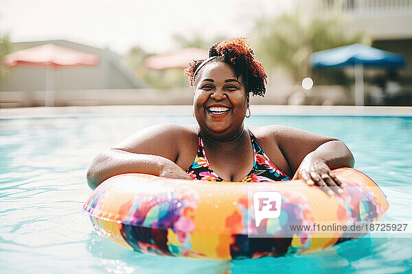 Happy black plus size woman in a pool with ring float. Generative AI.