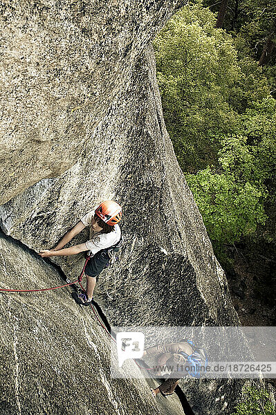 A young boy climbs a crack in Yosemite  June 2010.