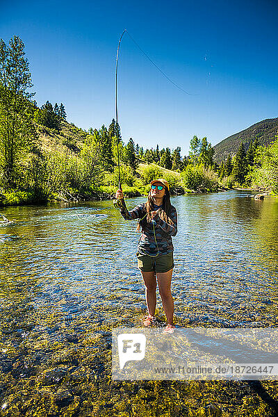 Woman Fly fishing on the Lake Fork River in Colorado