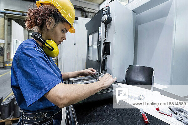 Maintenance engineer working in modern factory