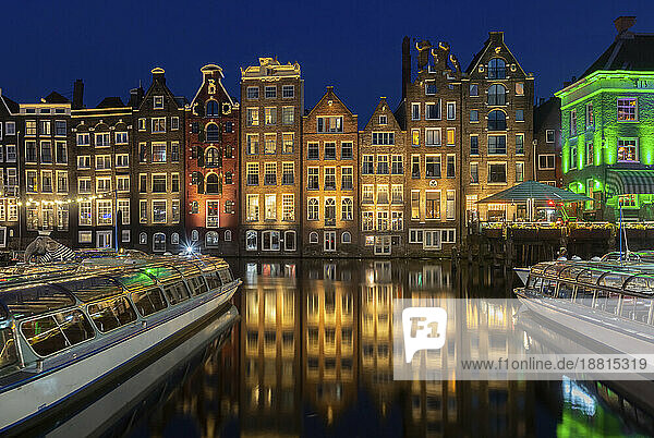 Netherlands  North Holland  Amsterdam  Row of townhouses along canal at night