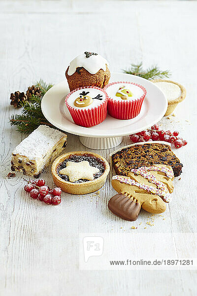 Selection of Christmas cakes - mince pies  cake stollen  ginger cookies