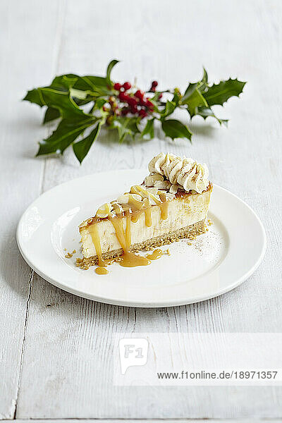 Christmas cheesecake with salted caramel almonds and whipped cream