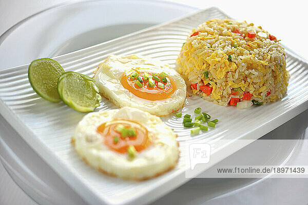 Vegetable rice tempura with fried eggs and lime