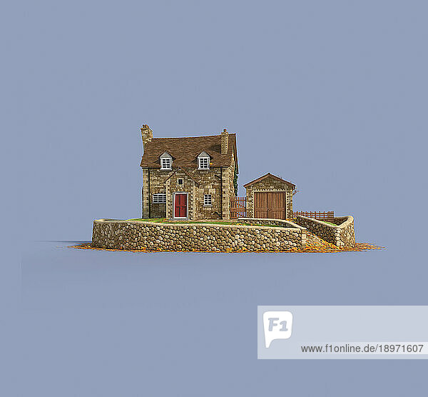 Idyllic stone cottage with boundary wall in autumn