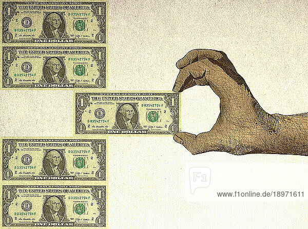 Hand entfernt Dollarschein aus der Mitte eines Stapels