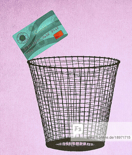 Credit card on edge of waste paper basket