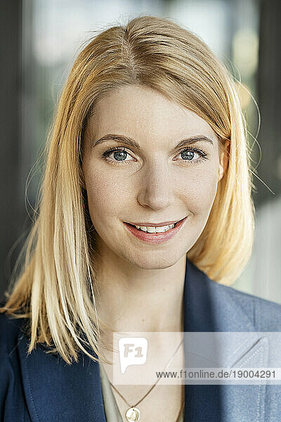 Smiling businesswoman with blond hair
