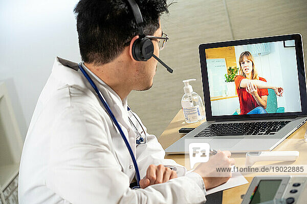 Doctor in remote consultation with a 30-year-old patient