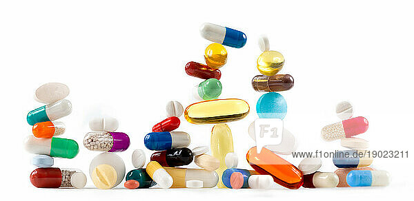 Capsules  tablets and capsules on a white background.