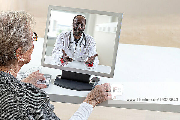 Elderly patient in teleconsultation from her computer.
