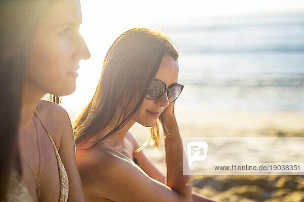 Portrait of two girls at sunset time.