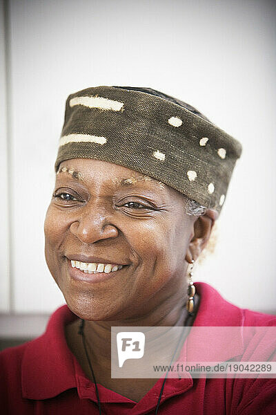 Portrait of a African American woman wearing a hat.
