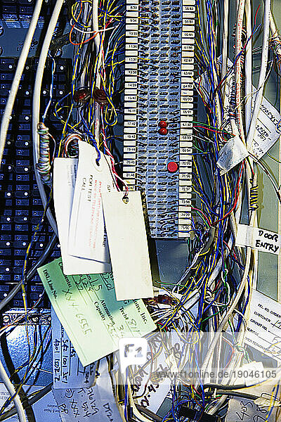 Front view close up of mass of jumbled wires on a circuit board  California.