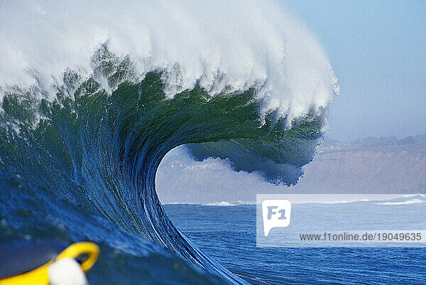 Frozen shot of a wave preparing to crash at Mavericks in Half Moon Bay  California.