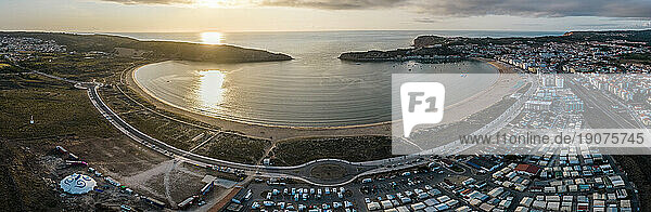 Aerial drone panoramic view at sunset of Sao Martinho do Porto bay,  shaped like a scallop with calm waters and fine white sand,  Oeste,  Portugal,  Europe