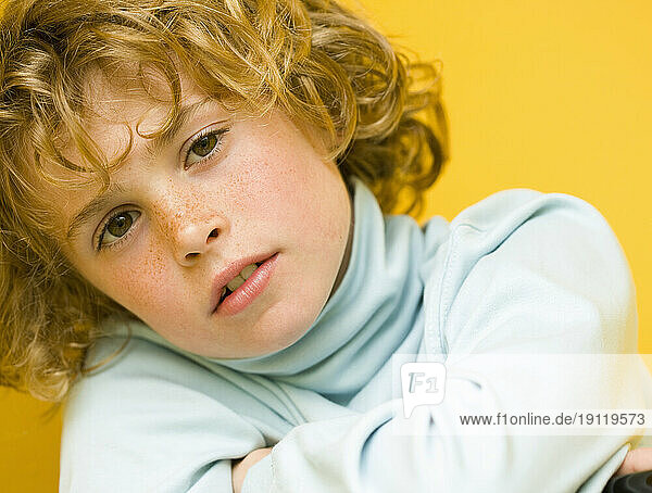Close up of a young boy with curly hair