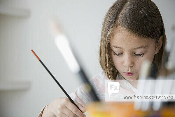 Close up of young girl painting