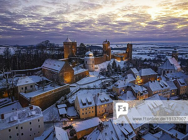 Castle and town of Stolpen on a winter evening