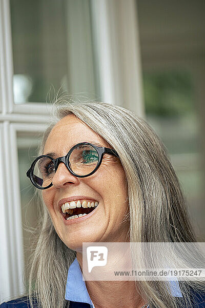 Happy mature businesswoman with gray hair
