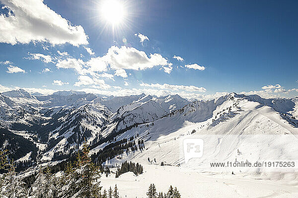 Austria  Vorarlberg  Sun shining over snowcapped peaks of Allgau Alps
