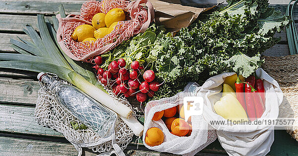 Fresh organic fruits and vegetables on table at market