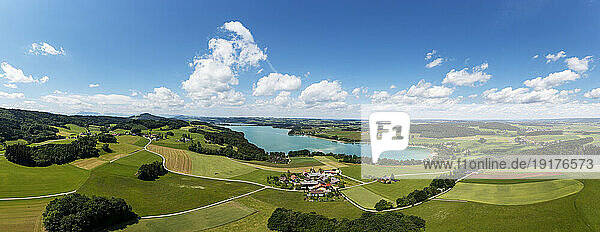 Austria  Salzburger Land  Drone panorama of Mattsee lake and surrounding fields in summer