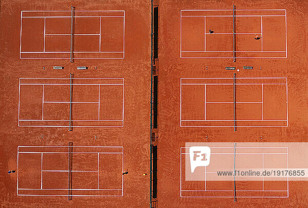 Drone view of rows of tennis courts