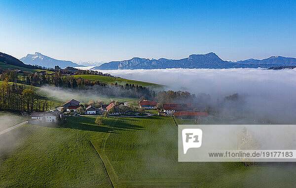 Austria  Upper Austria  Drone view of thick fog behind small village