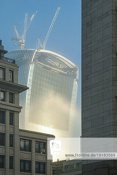 View of the top of the Walkie Talkie in London with reflecting the sunlight