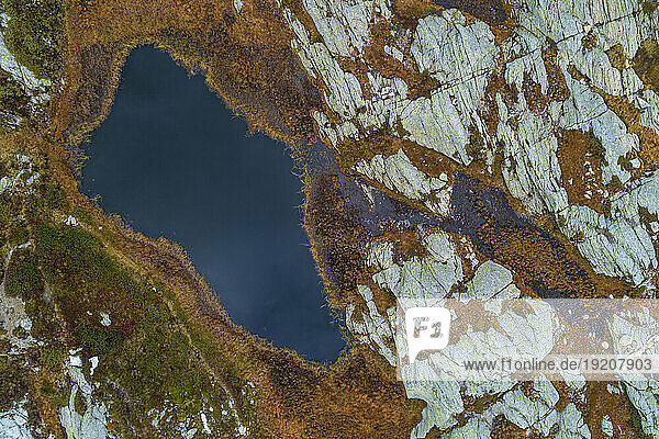 Switzerland  Graubunden Canton  Aerial view of small alpine lake in San Bernardino Pass area