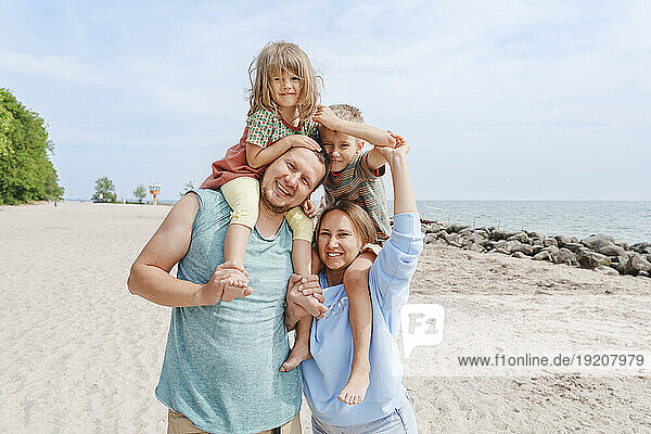 Smiling family having fun at beach