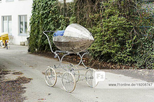 Abandoned baby stroller on road