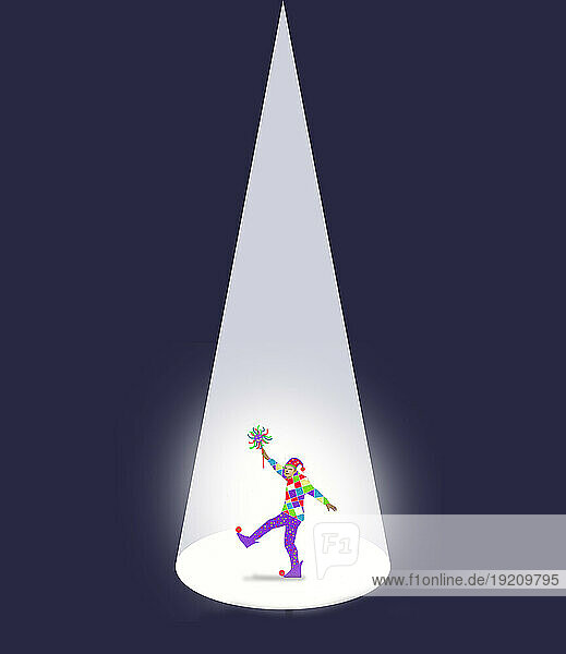 Male jester illuminated by spotlight