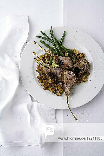 Lamb cutlet with roast potatoes and green beans