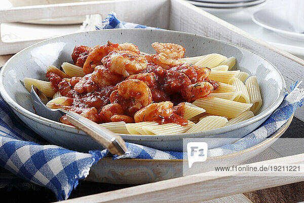 Penne with tomato sauce and shrimp