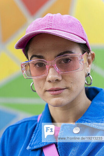 Woman wearing pink cap and sunglasses