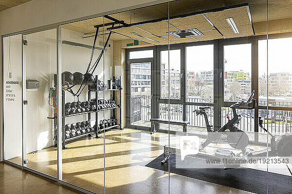 Gym with equipment in modern office