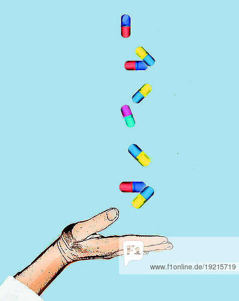 Capsules falling into open hand