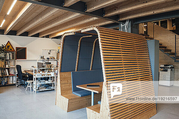 Wooden office cubical at modern workplace