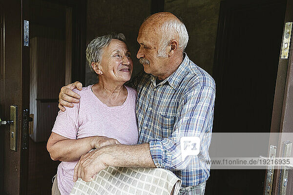 Senior couple hugging and looking at each other