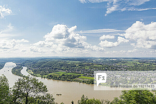 Germany  North Rhine Westphalia  Bonn  Clouds over riverside suburb in Drachenfels region