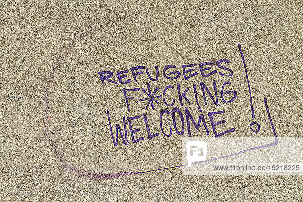 Anti-migrant slogan on a wall in Italy