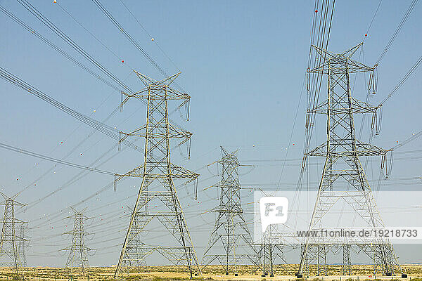 United Arab Emirates,  Abu Dhabi,  electricity pylons in the middle of the desert