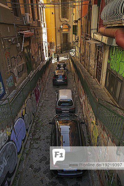 Italy  Campania  Naples  cars parked one behind the other in a narrow street  November 2021.