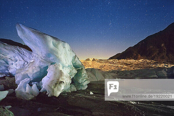 Twilight View Terminus Of The Mendenhall Glacier With A Large Iceberg In The Foreground And Starry Sky Overhead  Juneau  Southeast Alaska  Autumn